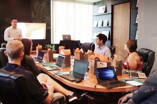 A group of employees lookng at a presenter