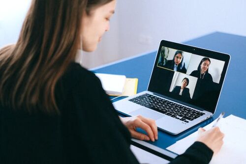 Woman at the computer during an online meeting