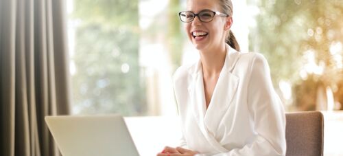 A woman smiling in the office.