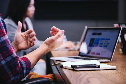 a person in a meeting talking about nurturing employee potential