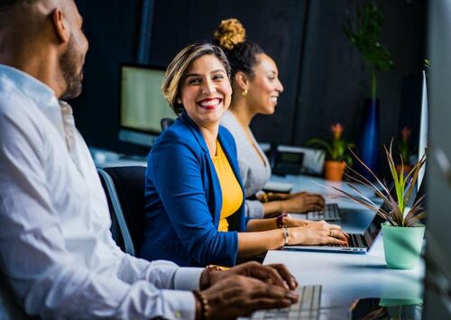 Happy employees at their workplace.