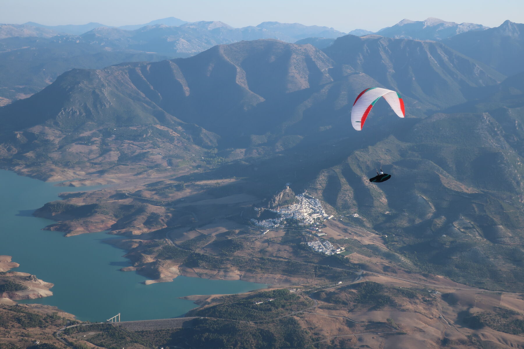 Why is Flyspain paragliding school and flight center one of the most popular in Europe? 