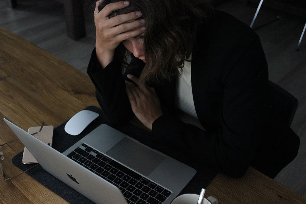 Women with head in her hands