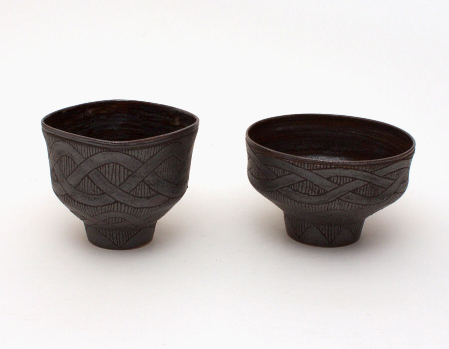Pair of carved stoneware tea bowls by Chris Carter
