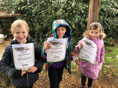 The Outdoors Project | Children holding up Outdoors Ambassador certificate