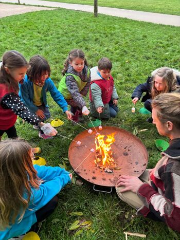 The Outdoors Project - after school club children toasting marshmallows campfire