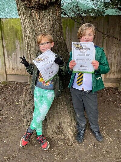 The Outdoors Project | Boys holding up Outdoors Ambassador certificate